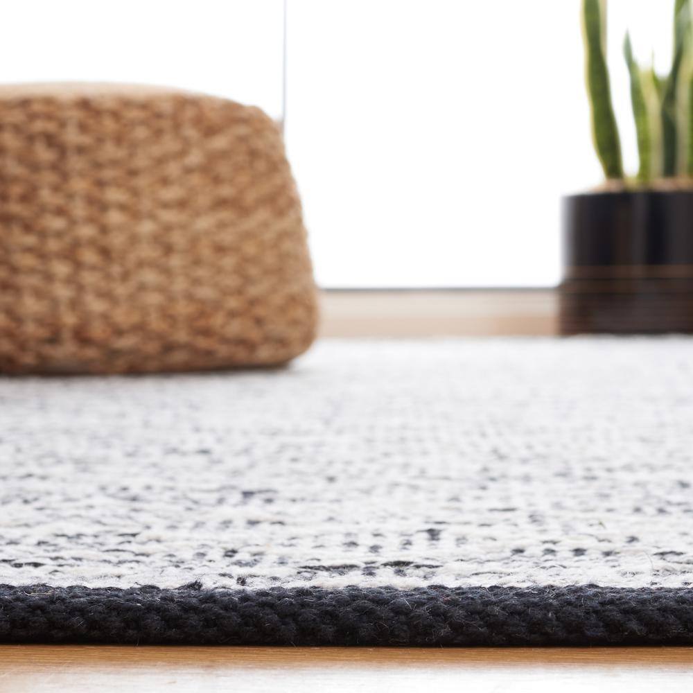 Ebony Black and Ivory Wool 6' x 9' Handmade Reversible Area Rug