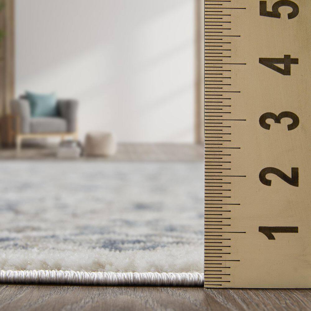 Cream and Blue Floral Border 6' x 9' Synthetic Area Rug