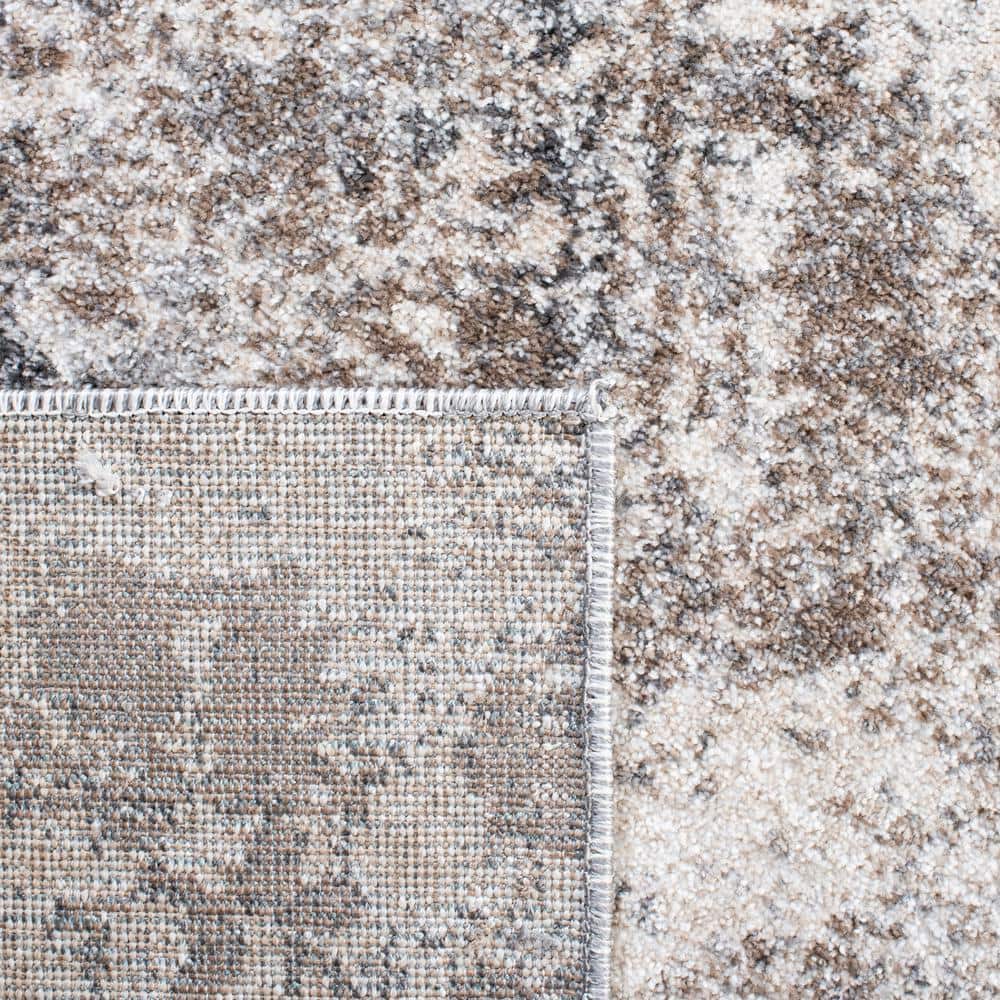 Ivory and Grey Abstract 6' x 9' Synthetic Area Rug