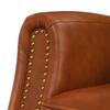 Close-up of nailhead trim detail on leather upholstery.