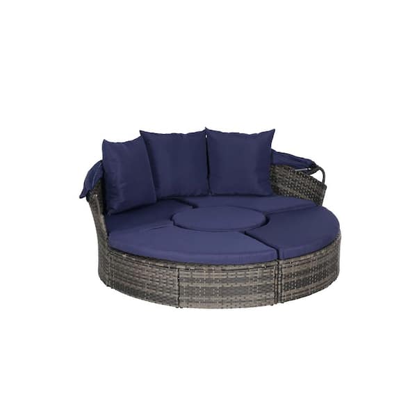 Gray Wicker Outdoor Day Bed with Dark Blue Cushions and Retractable Canopy
