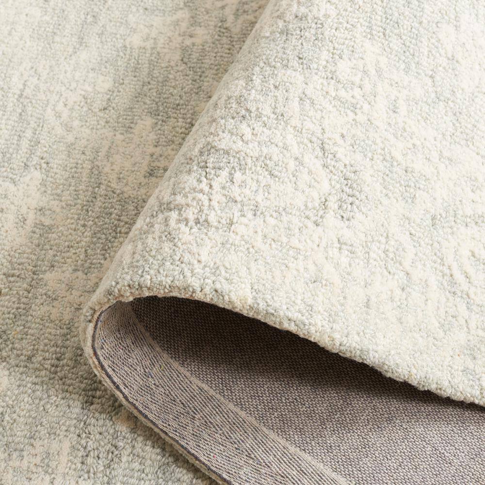 Handmade Light Blue Wool Tufted 6' x 9' Rectangular Rug