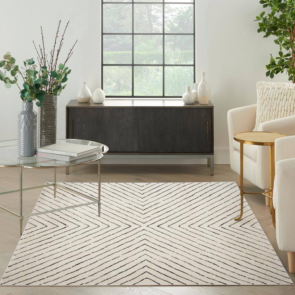 Ivory and Black Chevron Striped 5' x 7' Synthetic Area Rug
