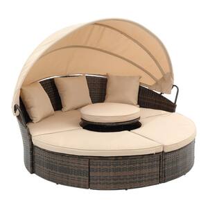 The Black Steel Frame is Covered with Brown Wicker Rattan Outdoor Patio Day Bed with Khaki Cushions