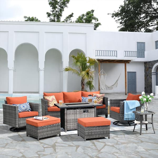XIZZI Hyperion 7-Piece Wicker Patio Rectangular Fire Pit Set and with Orange Red Cushions and Swivel Rocking Chairs