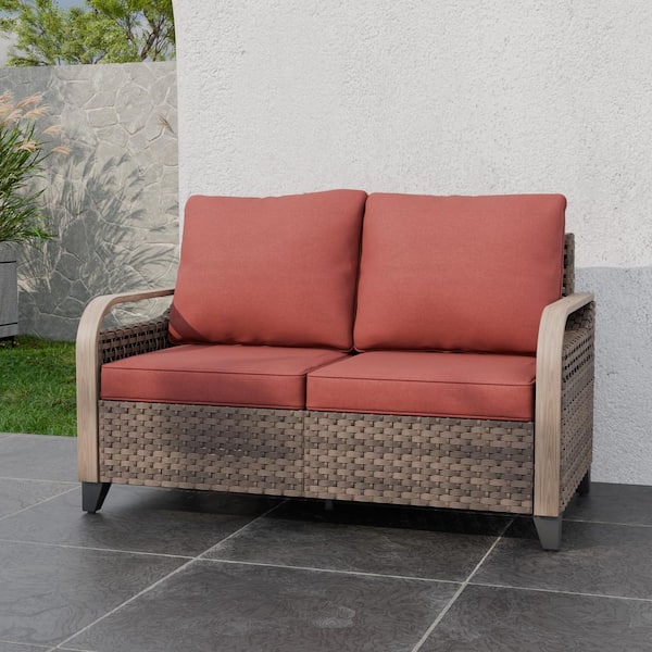 Brown Wicker Outdoor Patio Loveseat with Red Cushions