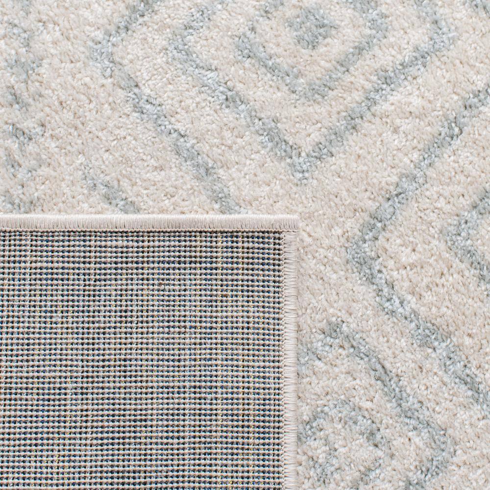 Ivory and Light Grey Geometric 6' x 9' Synthetic Area Rug