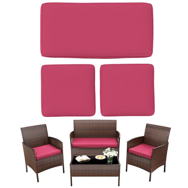 Three square pink seat cushions stacked on a white background.