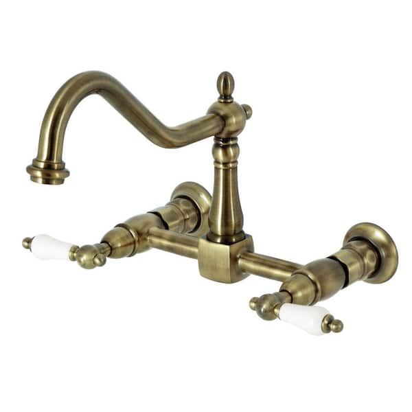 Kingston Brass Heritage 2-Handle Wall Mount Kitchen Faucets in Antique Brass