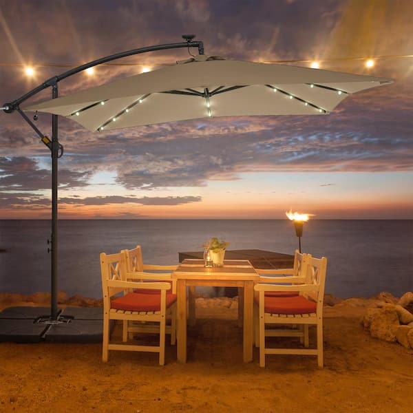 8.2 ft. x 8.2 ft. Solar LED Lighted Square Patio Cantilever Umbrella With a Base in Sand