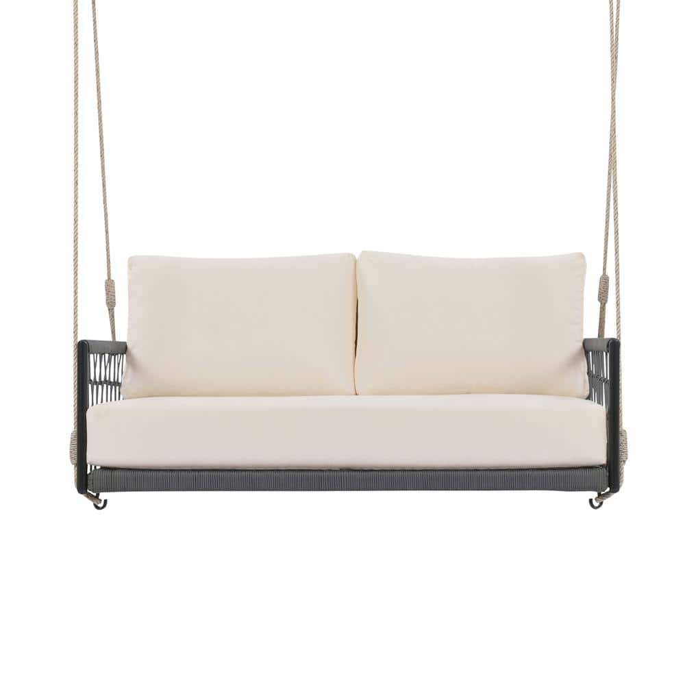 Black patio swing sofa with white cushions on a white background.