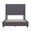 Full platform bed frame with gray upholstery.