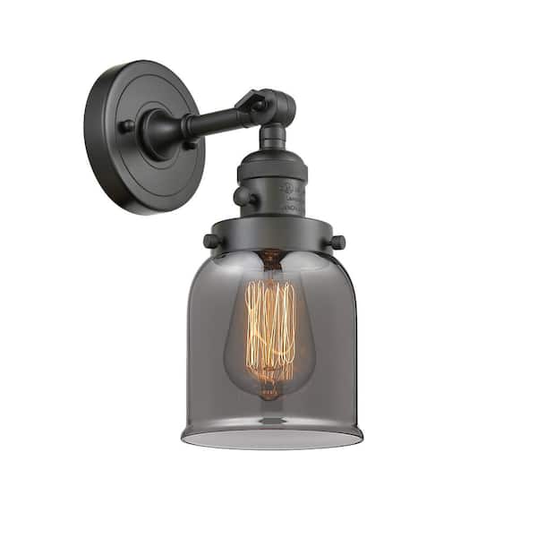 Innovations Bell 5 in. 1-Light Oil Rubbed Bronze Wall Sconce with Plated Smoke Glass Shade with On/Off Turn Switch
