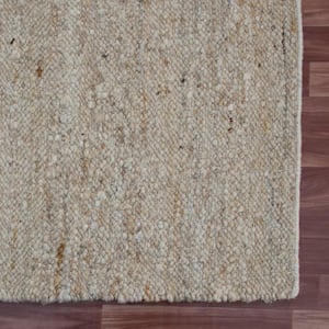 Andrew Ivory 9 ft. x 12 ft. Solid Hand-Woven Wool Blend Rectangle Area Rug