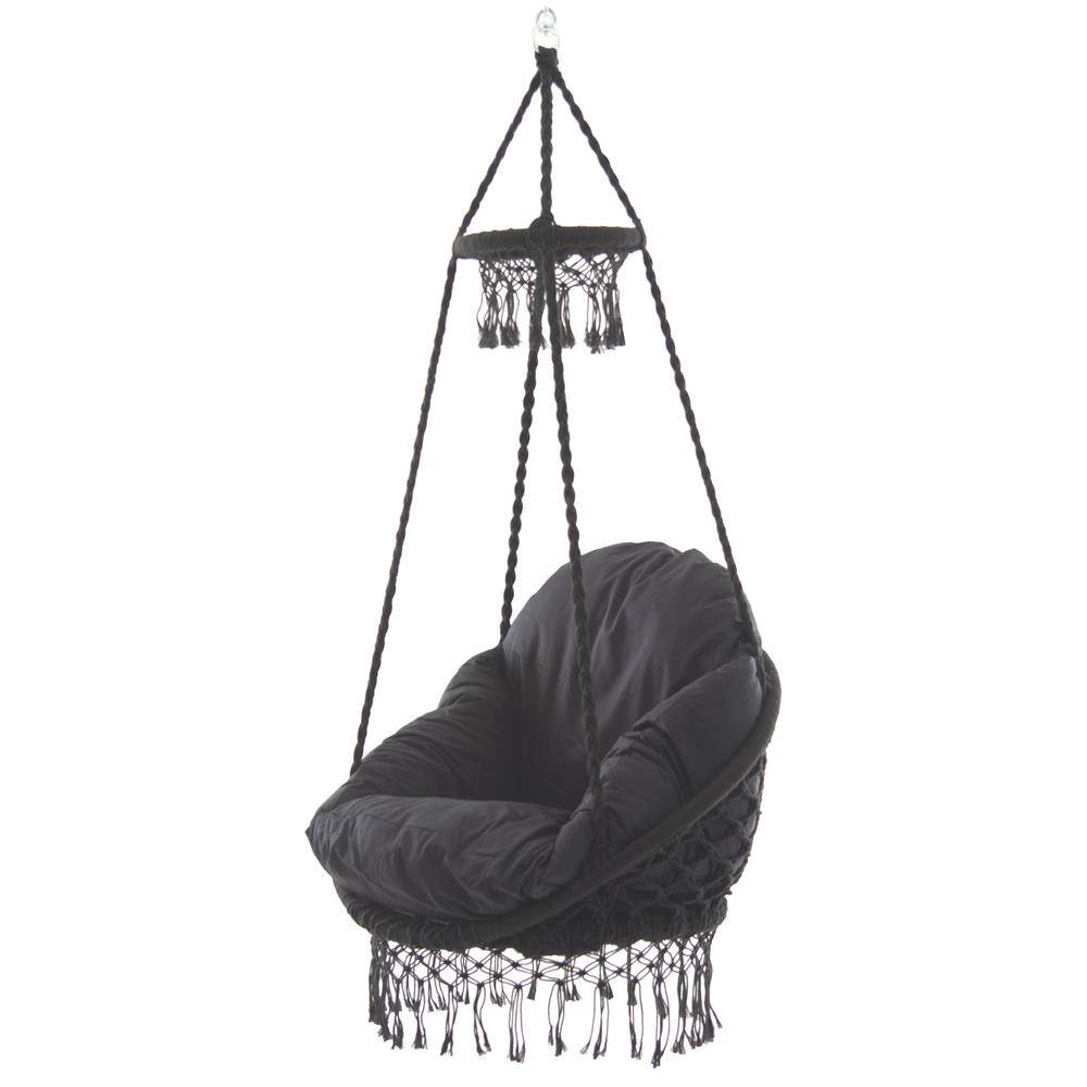 Black macrame hammock chair hanging with fringe details.
