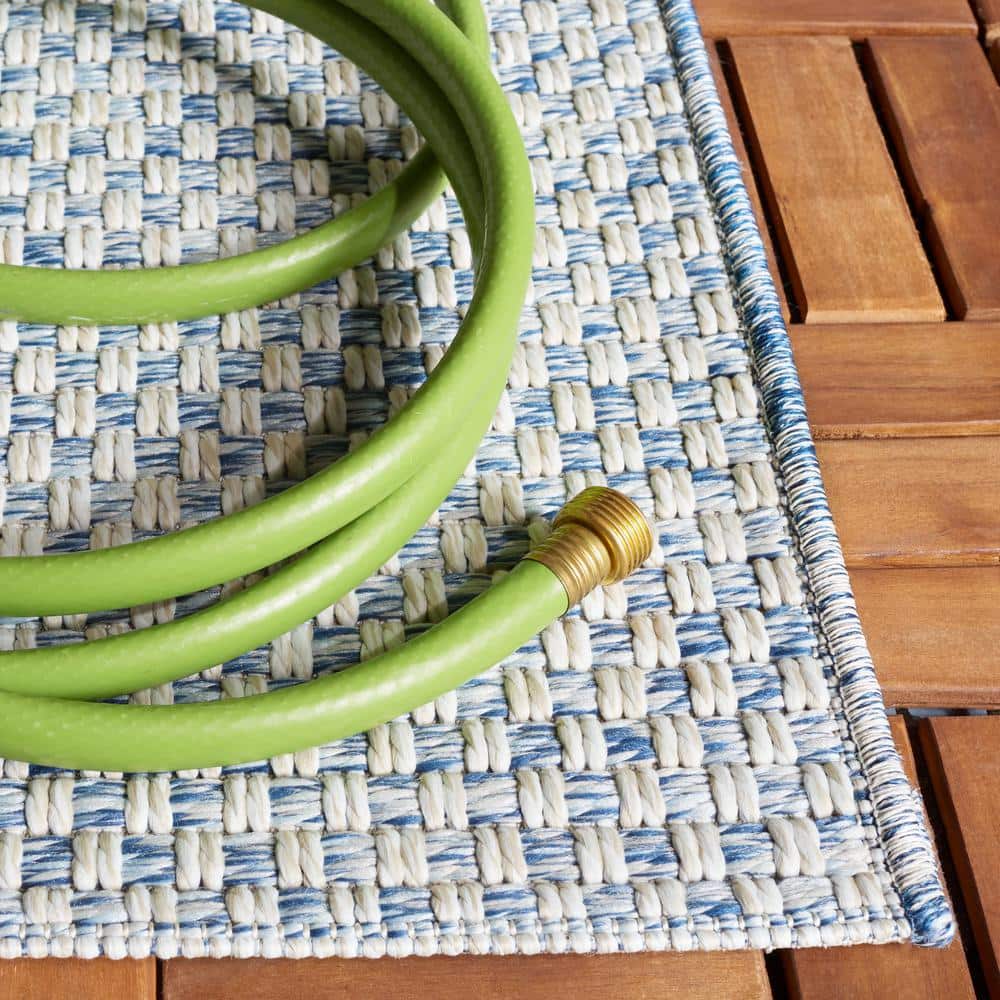 Blue and Ivory Synthetic Flat Woven Rectangular Rug, 5' x 7'