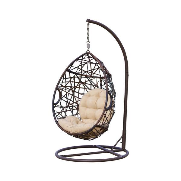 stefanie brown wicker patio swing with beige cushion