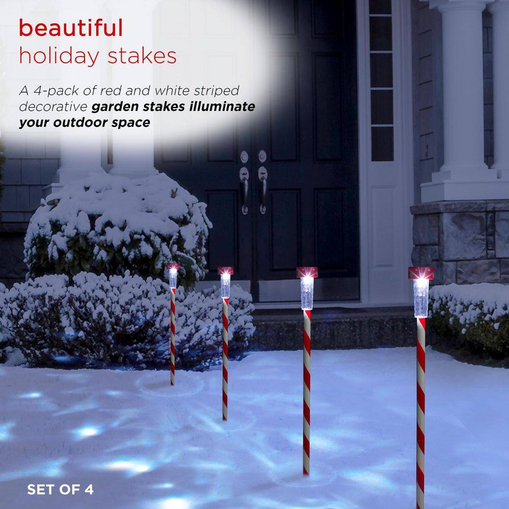 Alpine Corporation 27" Striped Plastic Solar Light-Up Holiday Garden Stakes, Set of 4, Red/White