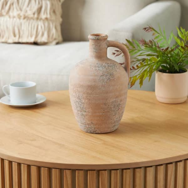 Litton Lane 11 in. Beige Antique Style Distressed Ceramic Pitcher Decorative Vase with Handle