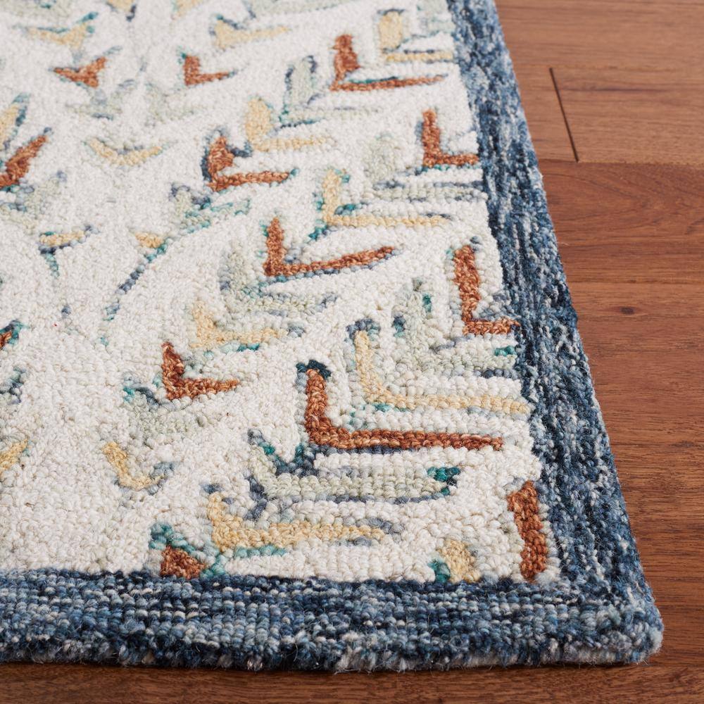 Hand-Tufted Ivory and Blue Wool 6' x 9' Area Rug