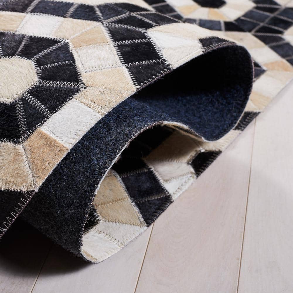 Handmade Black and Beige Geometric Cowhide Area Rug