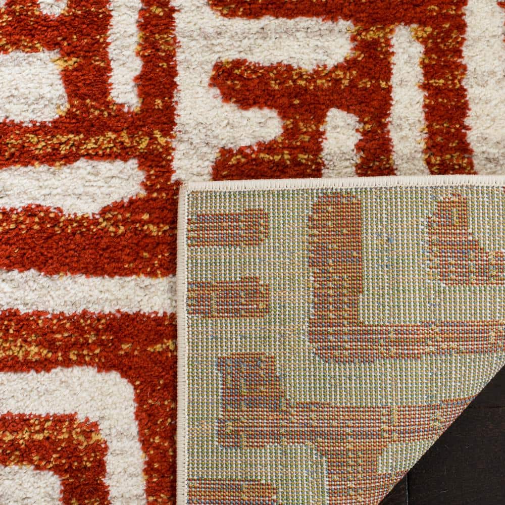 Ivory and Terracotta Geometric Synthetic Area Rug