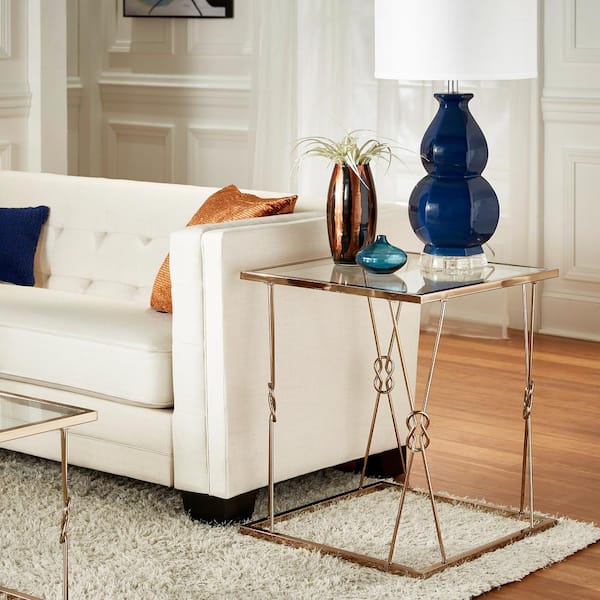 HomeSullivan Champagne Gold Finish With Reef Knot Frame And Glass Top End Table
