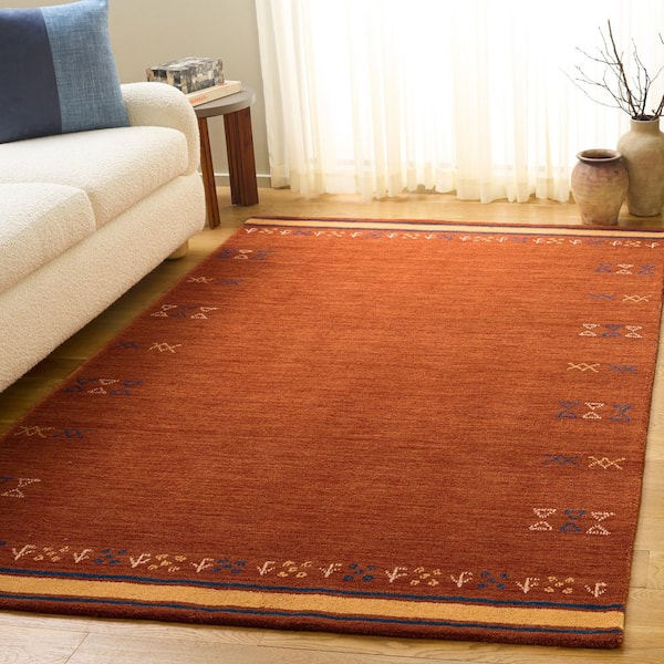 Himalaya 5 ft. x 8 ft. Rust Symbols Border Area Rug