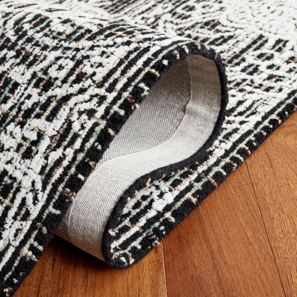 Handmade Black Wool 6' x 9' Tufted Area Rug
