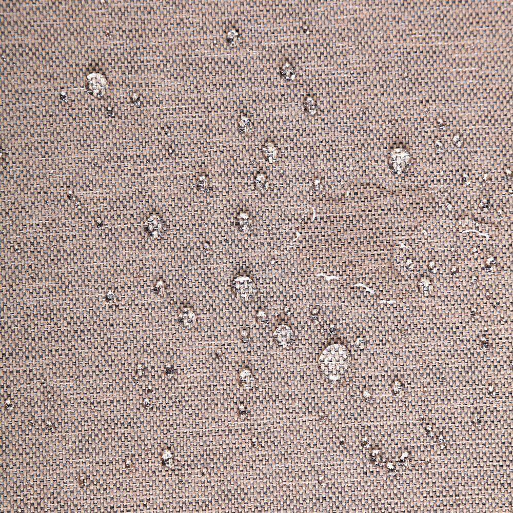 Water droplets on brown outdoor sofa fabric