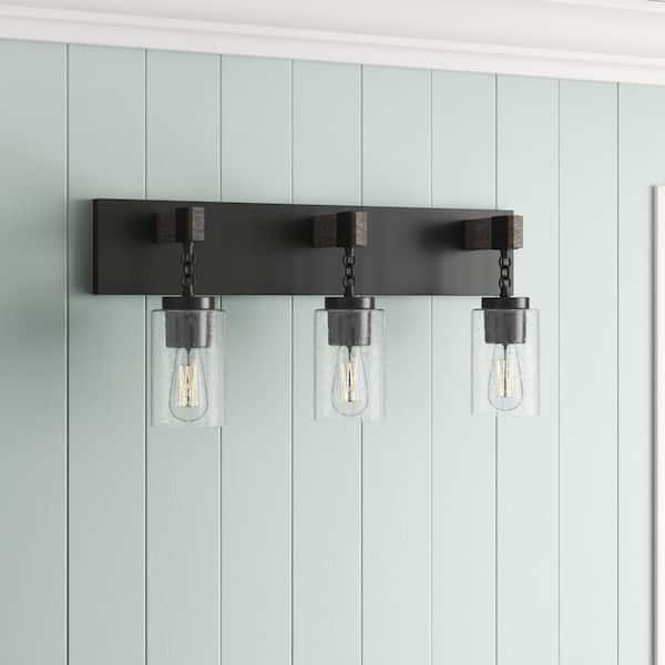 Fulton 24 in. 3-Light Matte Black Industrial Vanity Light with Clear Seedy Glass Shades