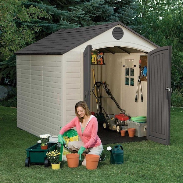 lifetime 8x10 storage shed with the doors open and a woman gardening