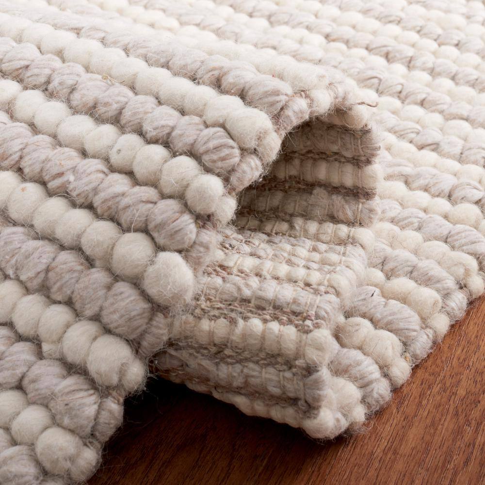 Ivory and Beige 8' x 10' Handwoven Wool and Synthetic Area Rug