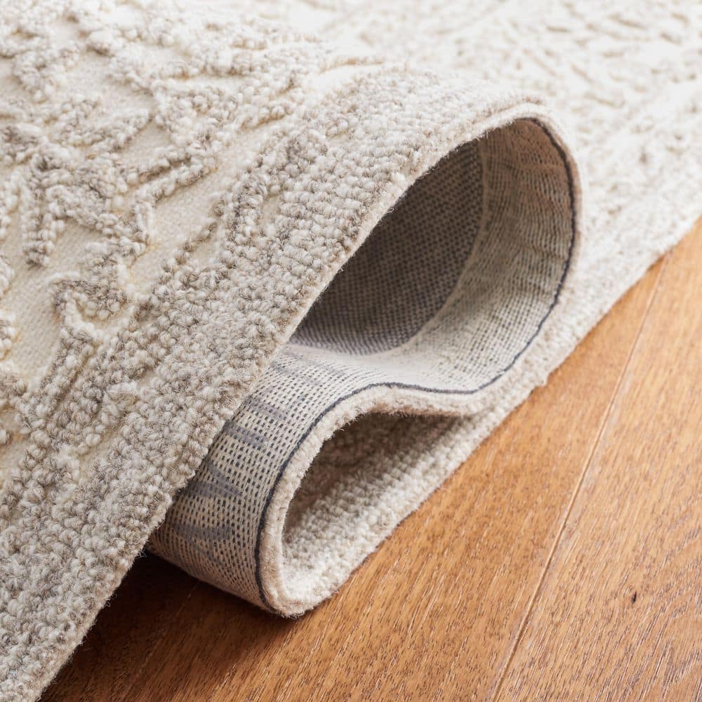 Ivory and Natural 4' x 6' Hand Tufted Wool Area Rug