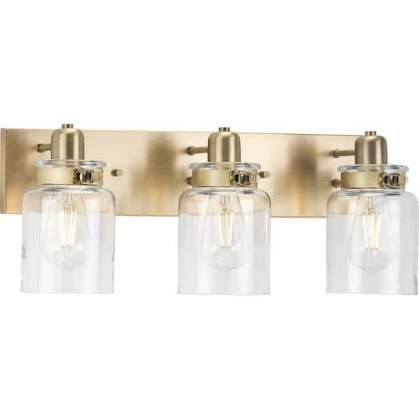 Progress Lighting Calhoun Collection 21-5/8 in. 3-Light Gold Vintage Brass Clear Glass Farmhouse Urban Industrial Bathroom Vanity Light