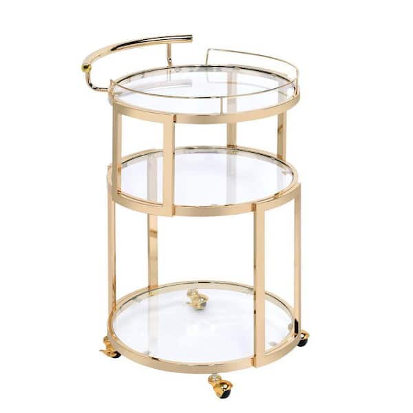 Benjara Gold 3-Tiered Metal Serving Cart with Glass Inserted Shelves and Curved Side Handle
