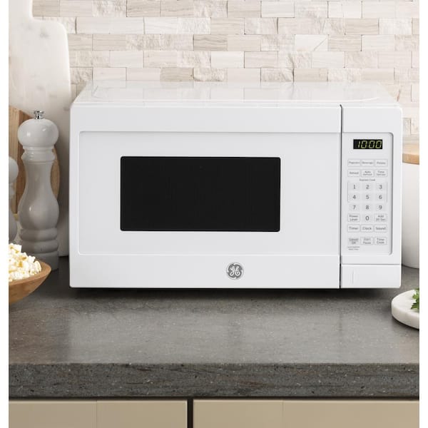 Mainstays 0.7 Cu ft Compact Countertop Microwave Oven, White – The Market  Depot
