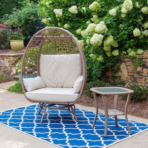 Rio Vista Swivel Wicker Outdoor Egg Lounge Chair with Side Table and Beige Cushions