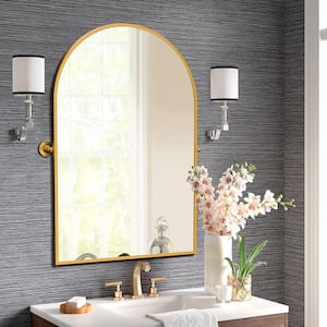24 in. W x 36 in. H Arched Metal Framed Pivoted Wall Vanity Mirror