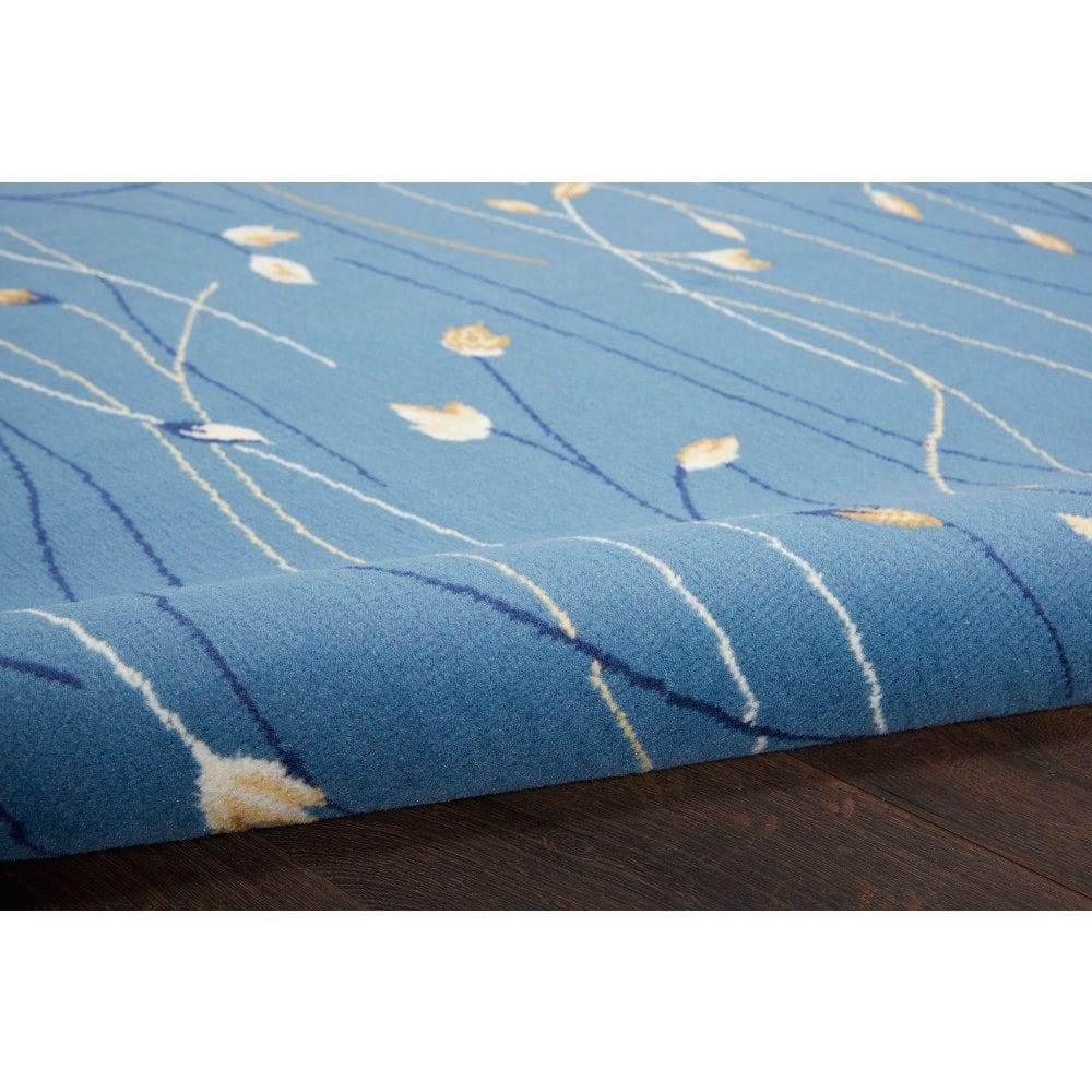 Light Blue Floral Synthetic 5' x 7' Area Rug
