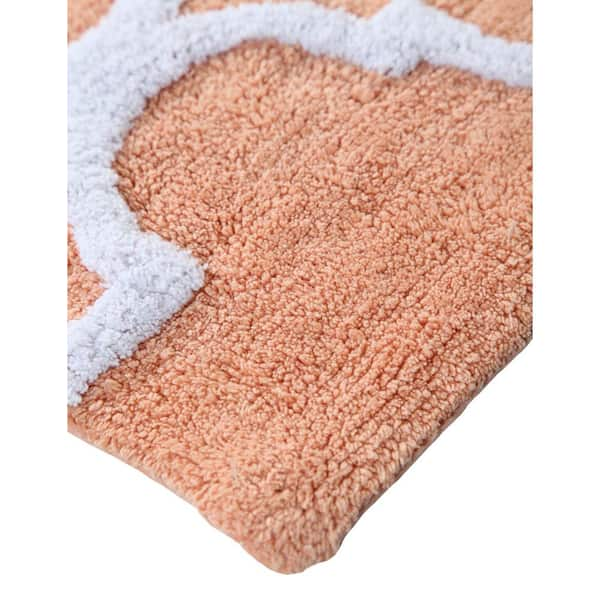 https://images.thdstatic.com/productImages/2d5c0abe-3e21-4058-bc7e-a82673543a57/svn/coral-white-saffron-fabs-bathroom-rugs-bath-mats-sfbr1451-44_600.jpg