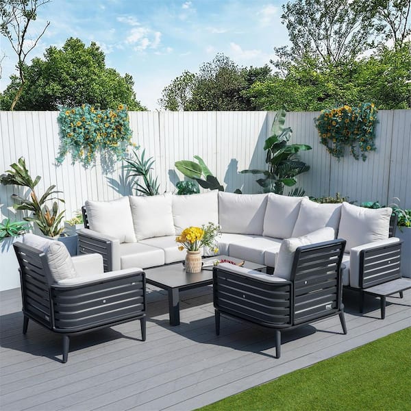 DIRECT WICKER Steven Dark Grey 7-Piece Aluminum Patio Conversation Set with Beige Cushions, a Coffee Table