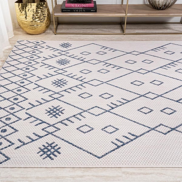 https://images.thdstatic.com/productImages/2de9608d-7316-4083-af76-9d8236de038e/svn/ivory-navy-jonathan-y-outdoor-rugs-smb123b-5-1d_600.jpg