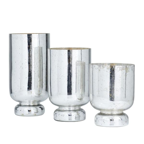 https://images.thdstatic.com/productImages/2deed36f-e6cd-5b20-9679-935f80d8b967/svn/silver-litton-lane-candle-holders-040297-c3_600.jpg