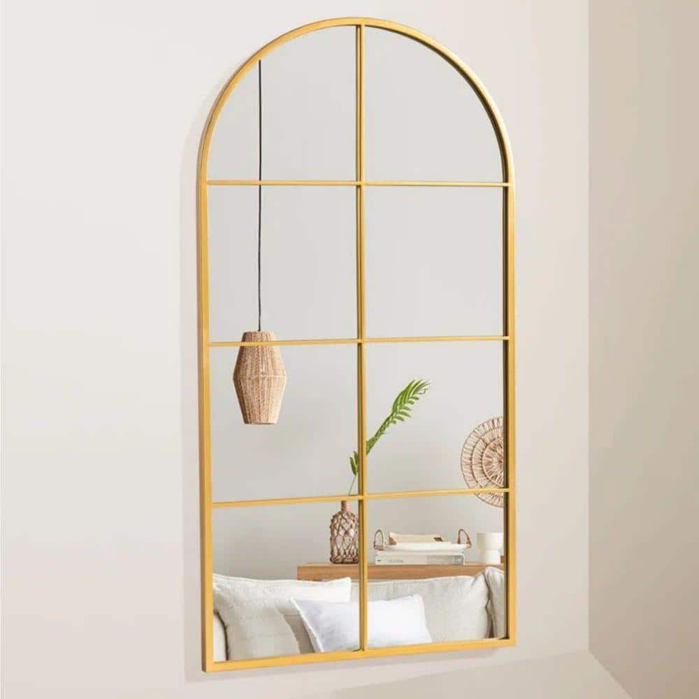 28 in. W x 55 in. H Arched Metal Frame Wall Mirror in Gold