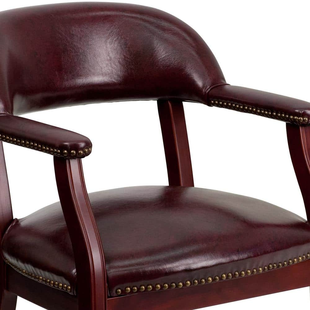 Elegant Oxblood Vinyl Conference Chair with Brass Nail Trim