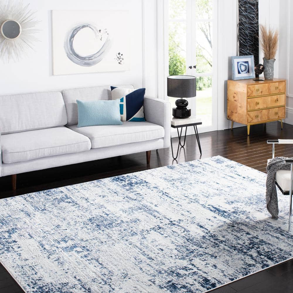 Amelia Ivory and Navy Abstract Synthetic Area Rug, 12' x 18'