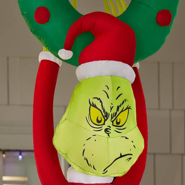 The grinch inflatables sold hanging gifts