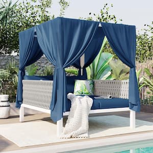 White Metal and Rubber Core Rope Outdoor Day Bed with Blue Curtains and Blue Cushions