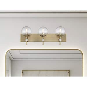 Populuxe 28 in. 3-Light Oxidized Aged Brass Vanity Light with Clear Volcanic Glass Shades